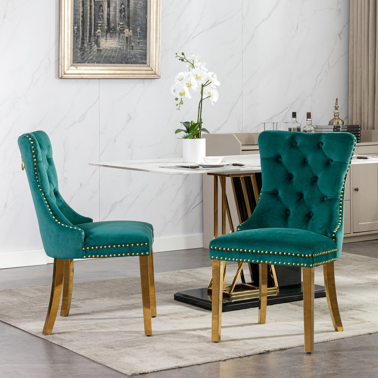 Emerald velvet dining chair with gold nailhead trim and brass legs