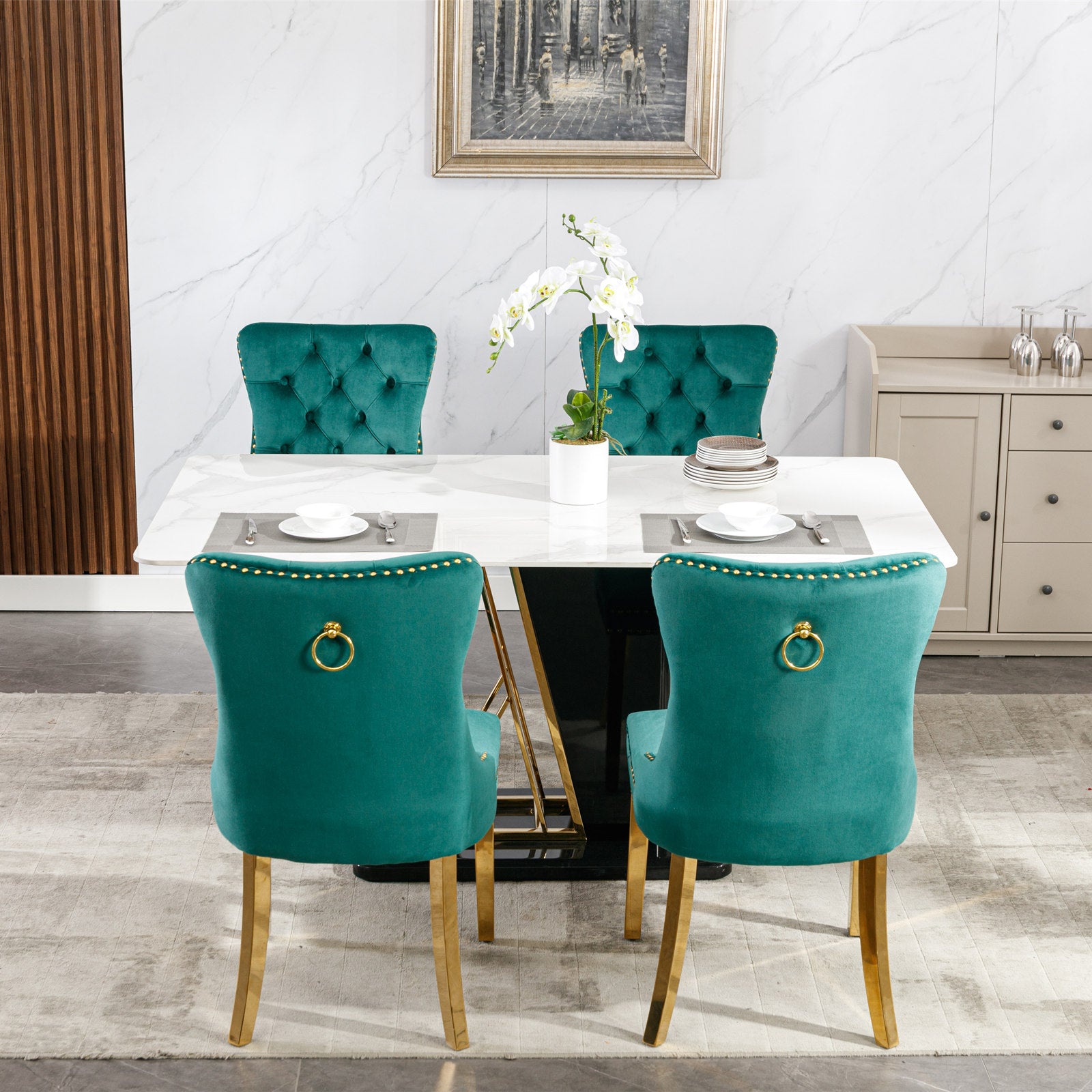 Emerald velvet dining chair with tufted back and gold ring pull
