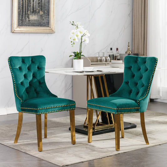 Emerald velvet dining chair with gold nailhead trim and brass legs