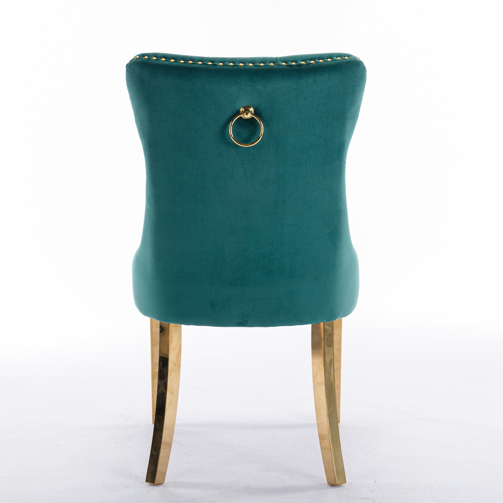 Deep green velvet dining chair with gold ring pull and studded trim