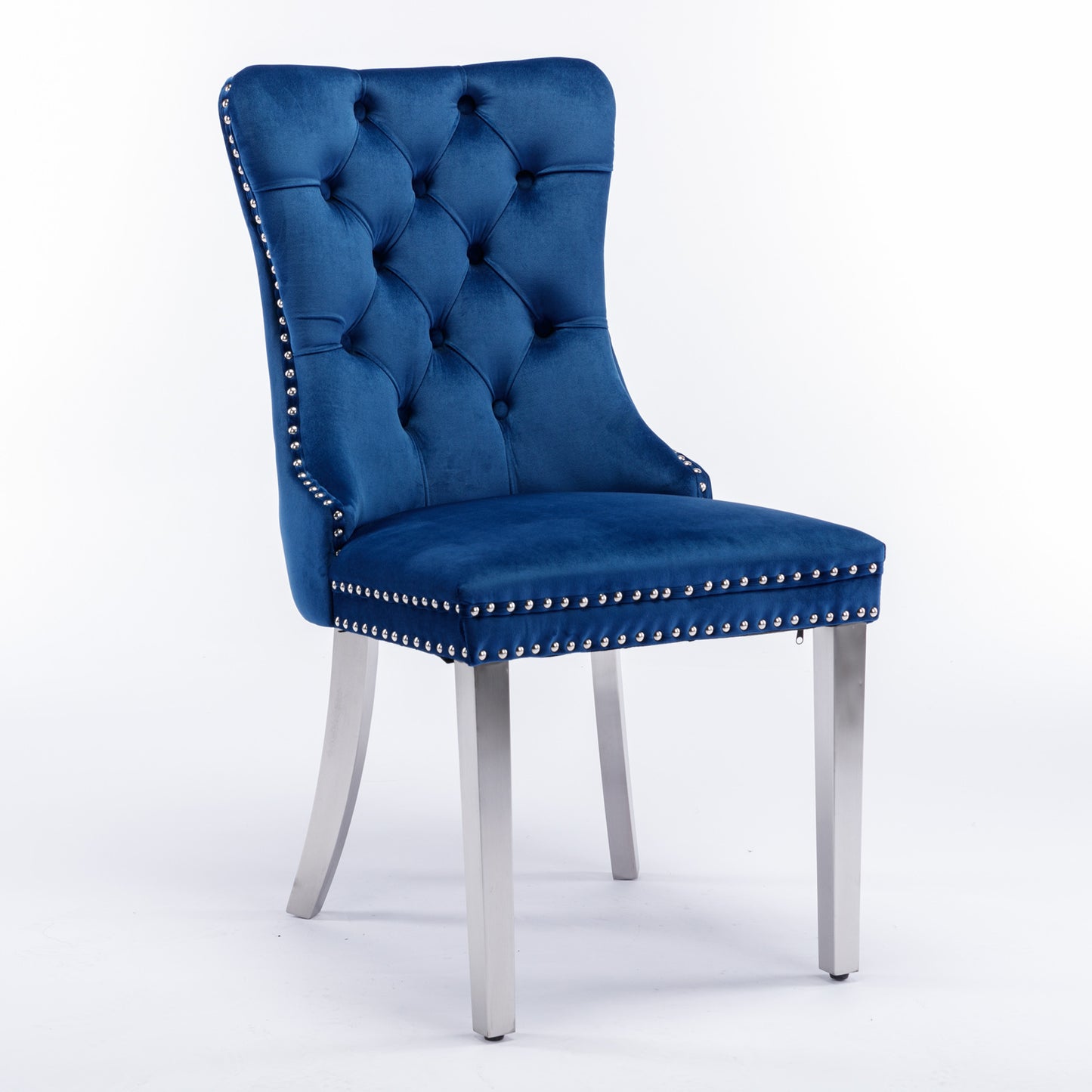 Deep blue velvet dining chair with tufted back and silver nailhead trim