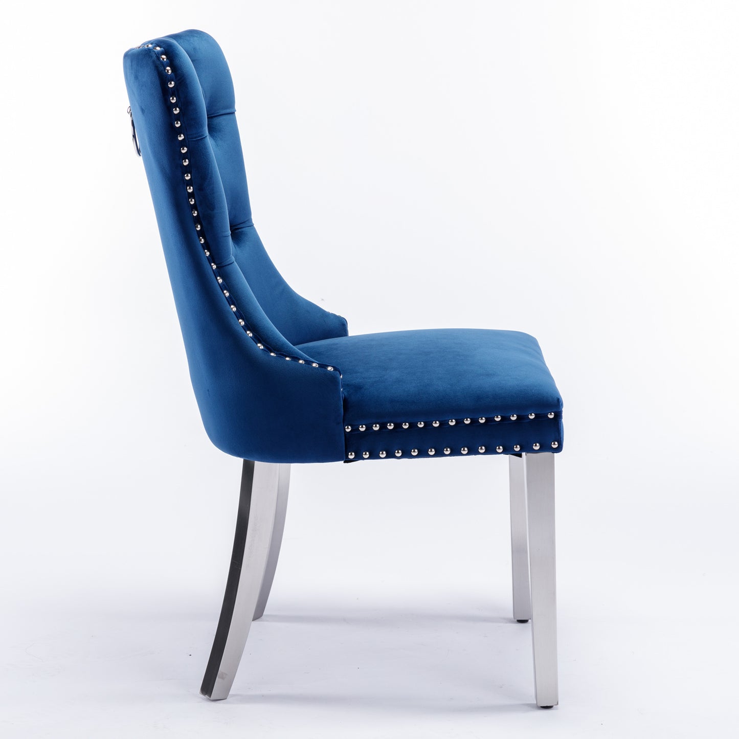 Deep blue velvet dining chair with silver stud trim and brushed metal legs