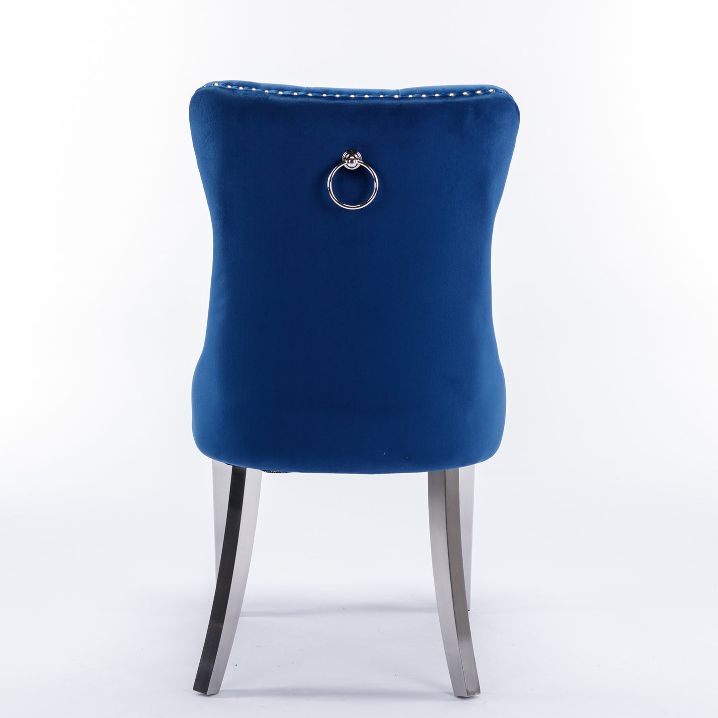 Navy blue velvet dining chair with silver ring pull and button tufting
