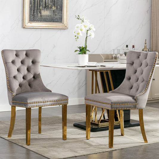 Gray velvet dining chair with tufted back and gold legs