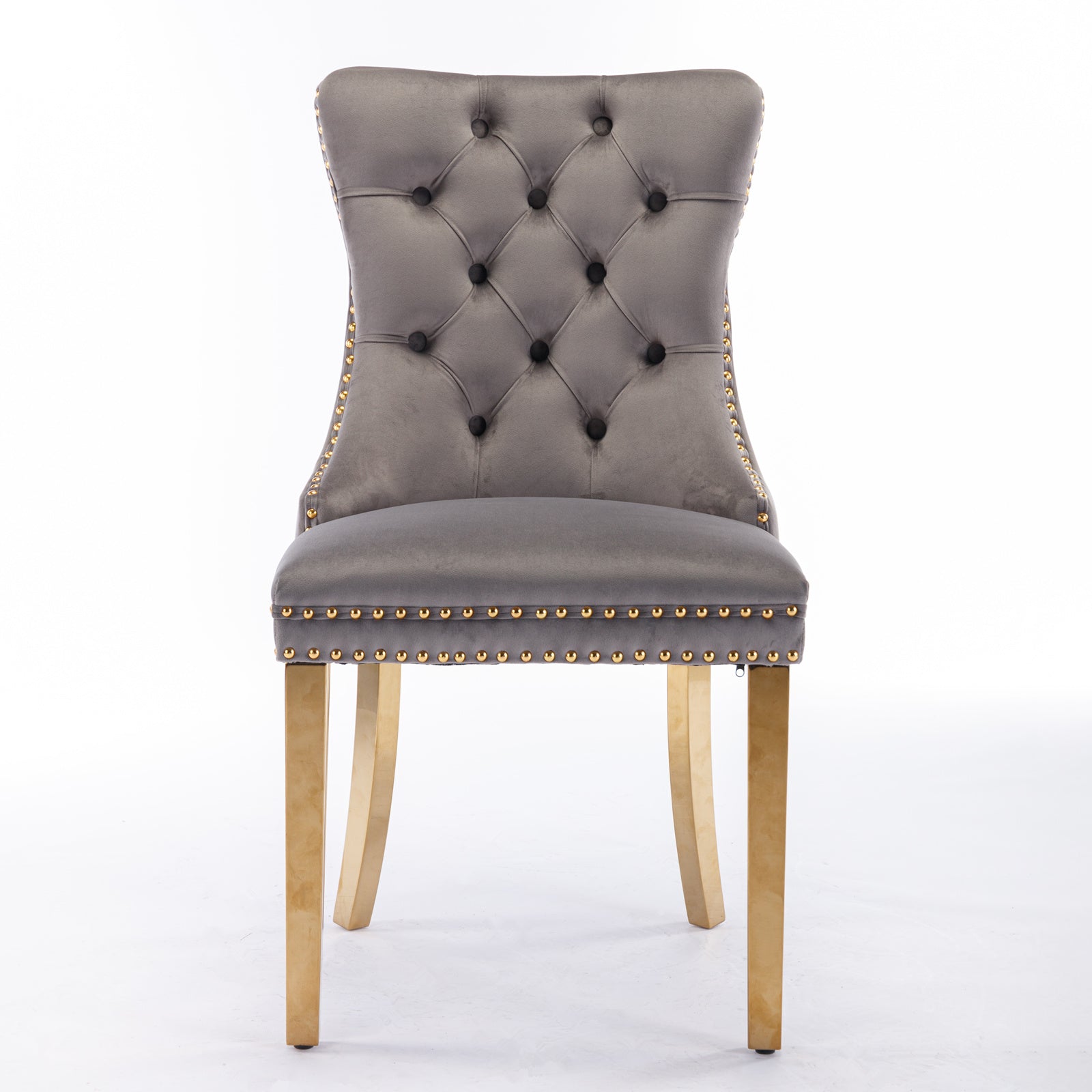 Grey velvet dining chair with gold stud accents and golden legs