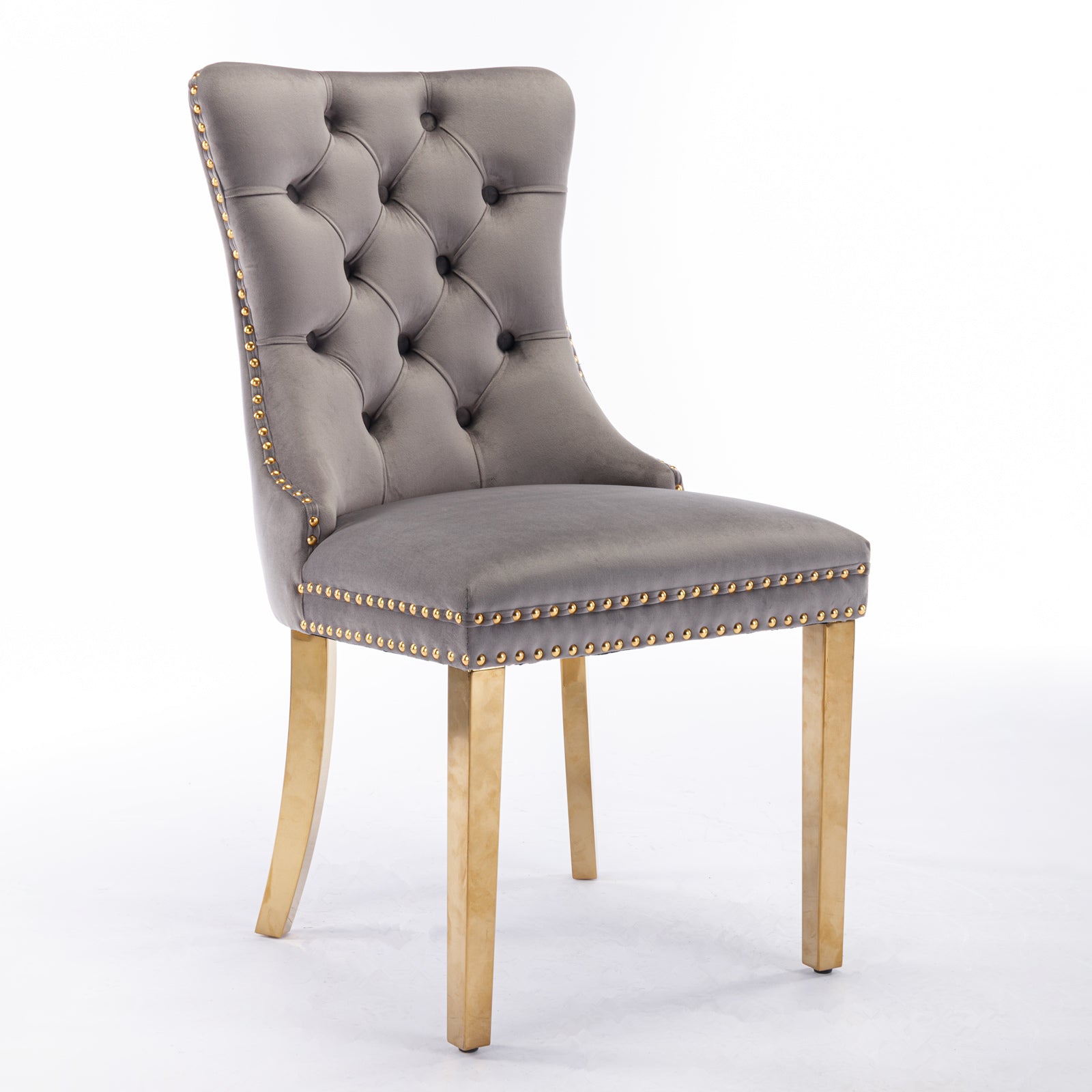 Tufted grey velvet dining chair with gold nailhead trim and brass legs