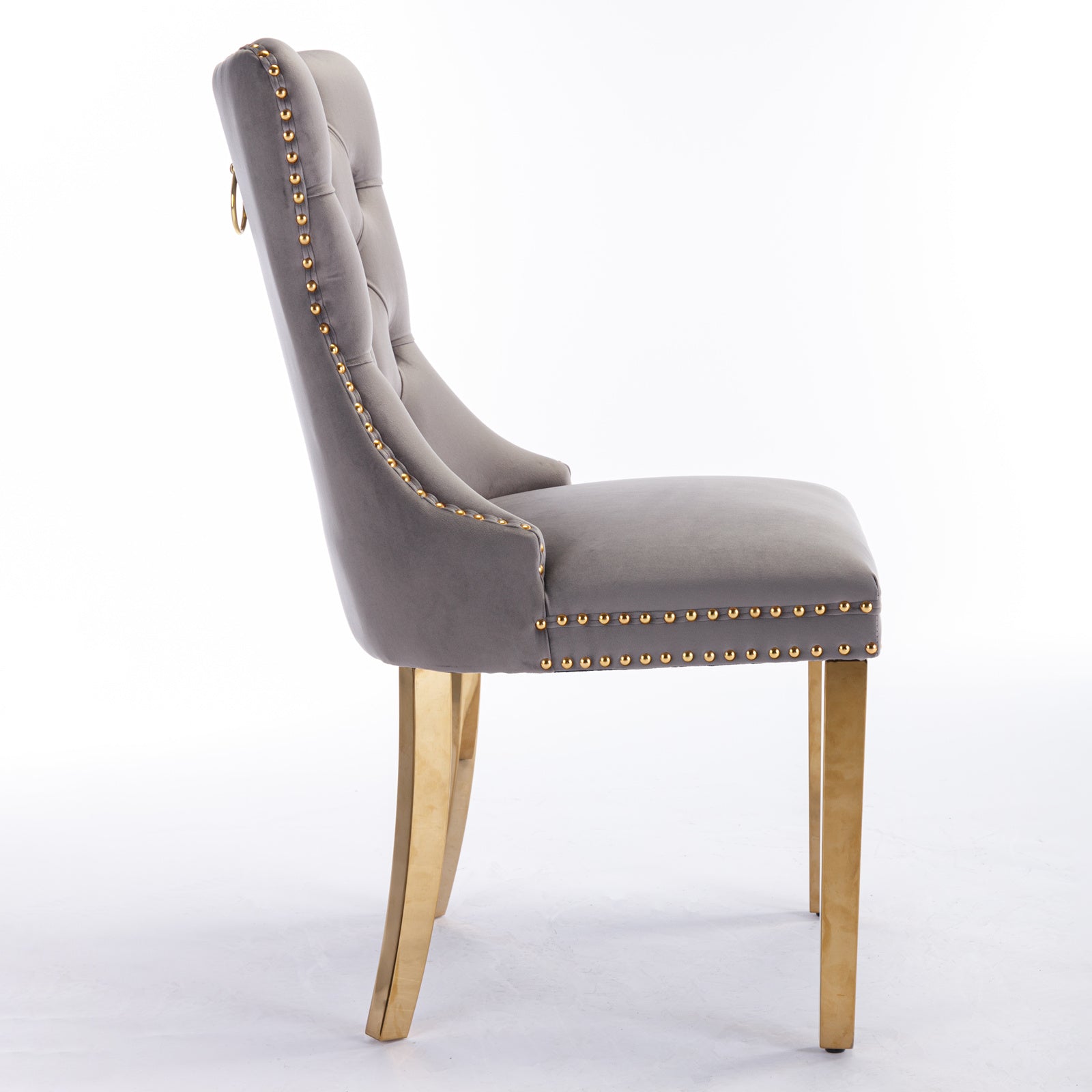 Grey velvet dining chair with gold stud trim and gold legs
