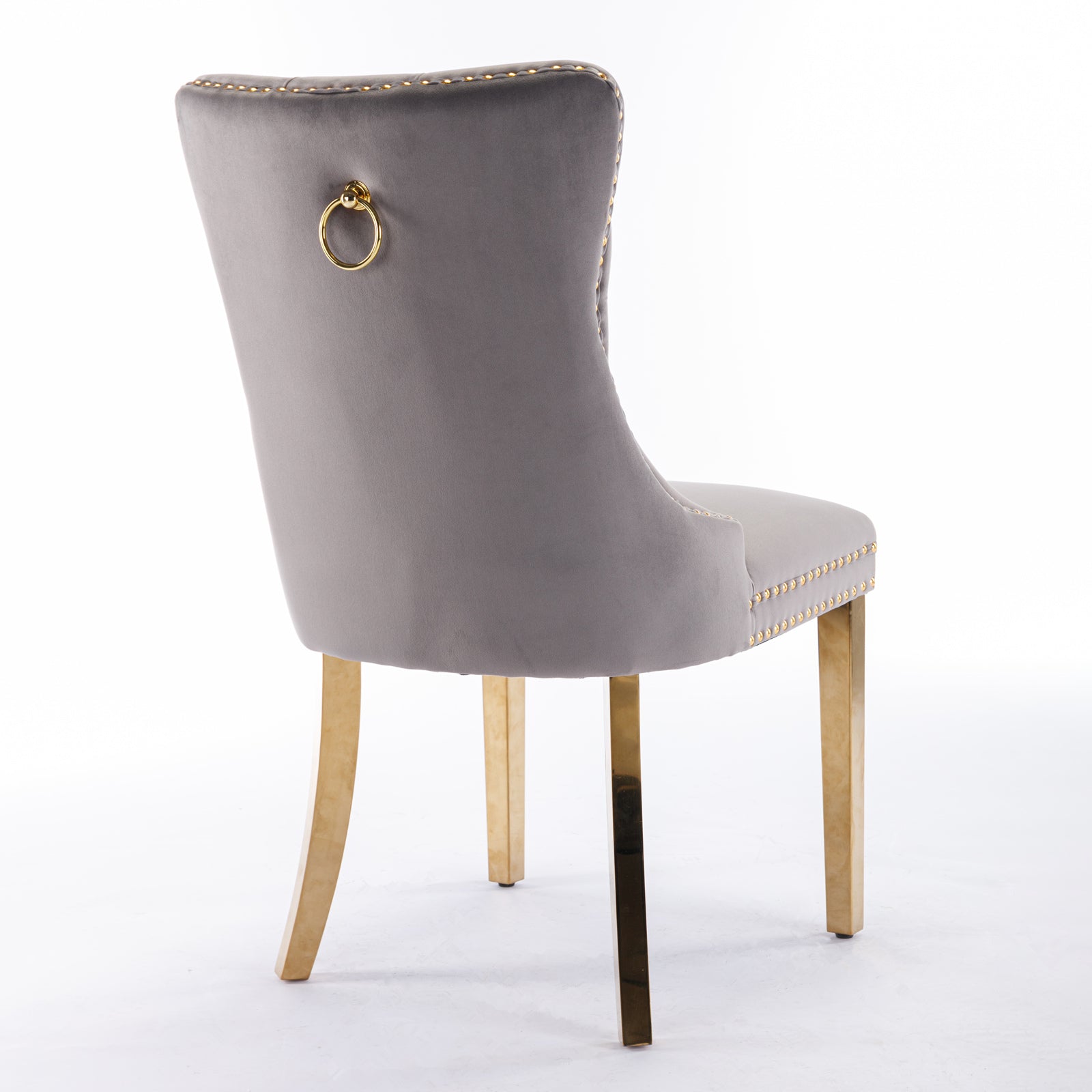 Grey velvet dining chair with gold ring pull and brass legs