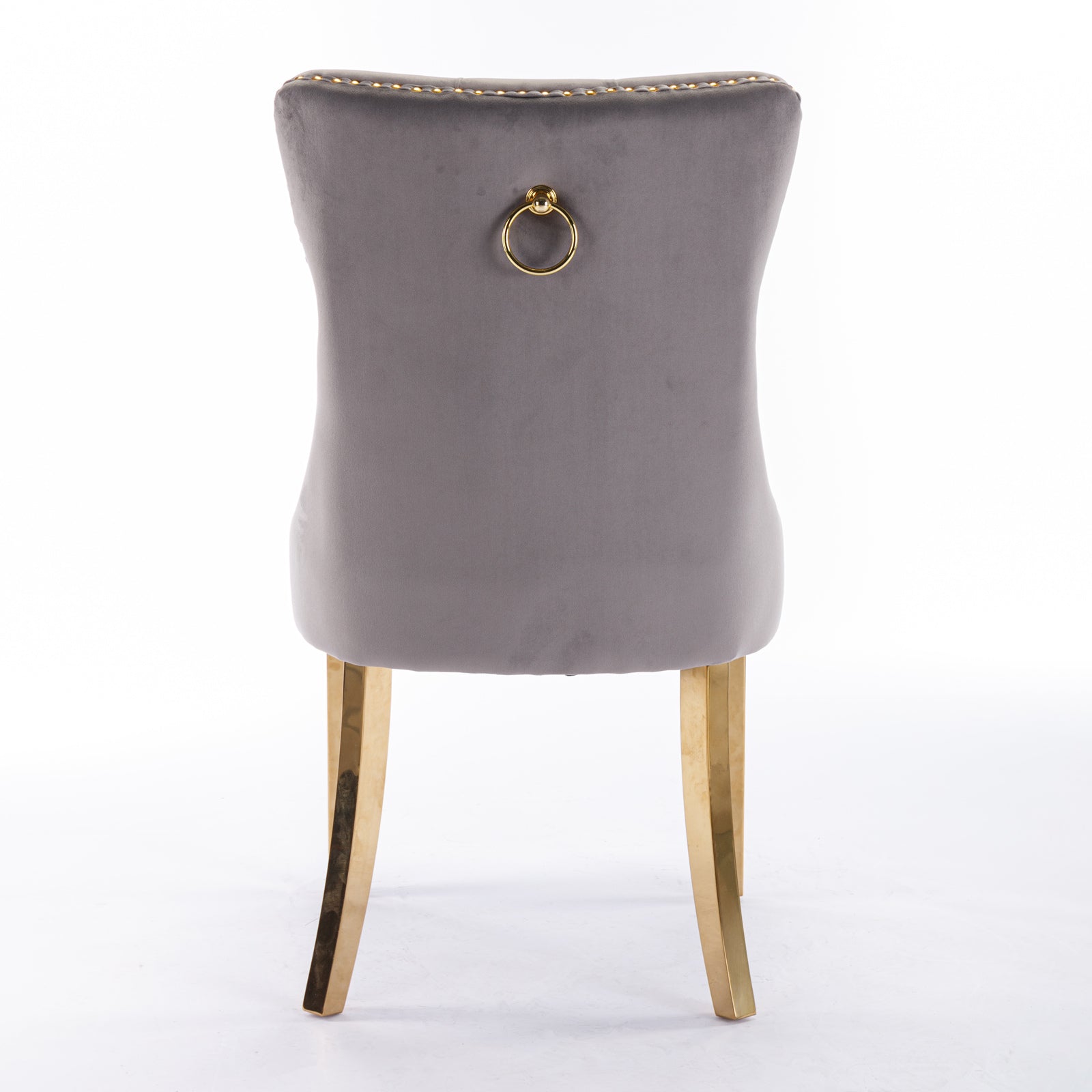 Grey velvet dining chair with gold ring detail and brass legs