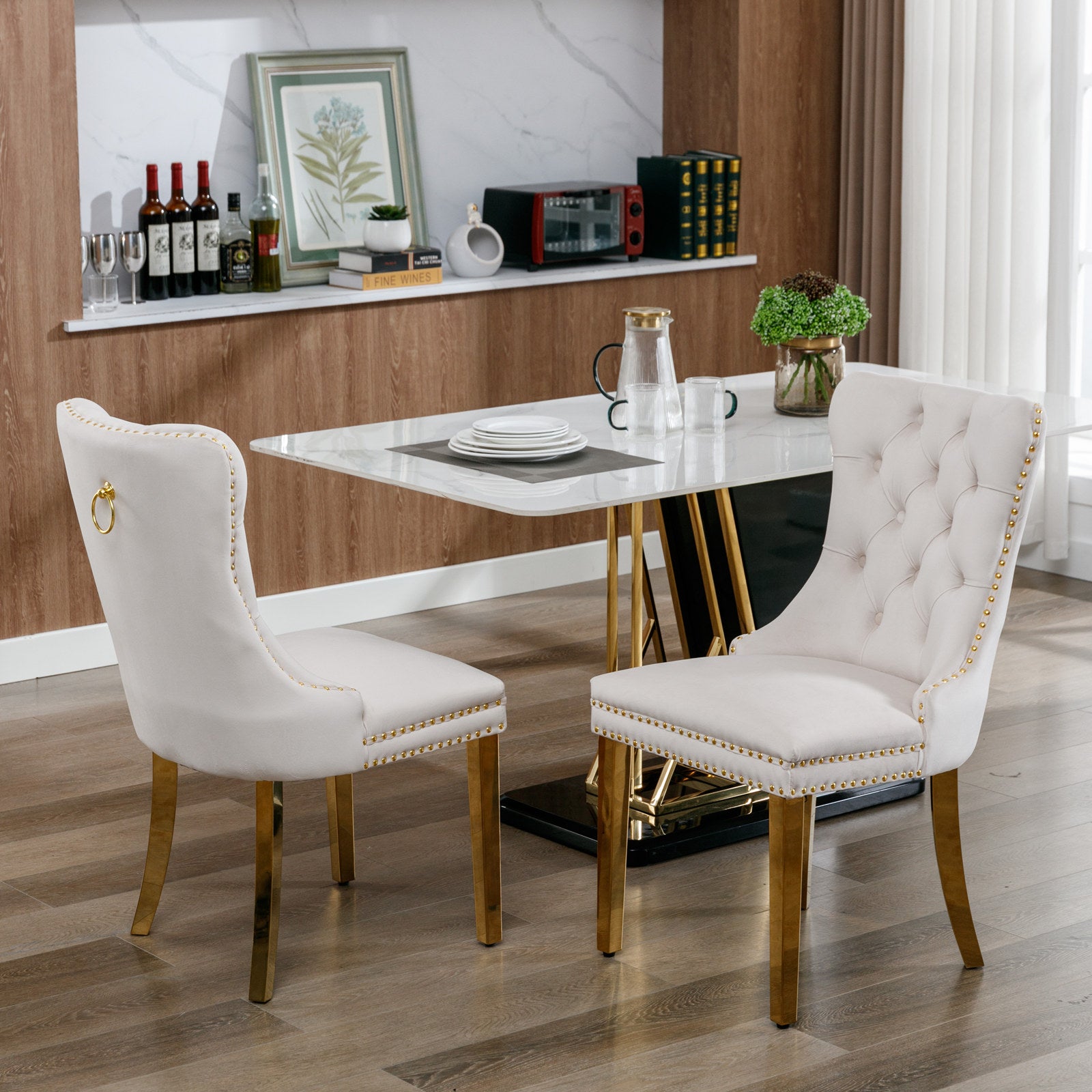 Tufted cream velvet dining chair with gold trim and ring pull accent
