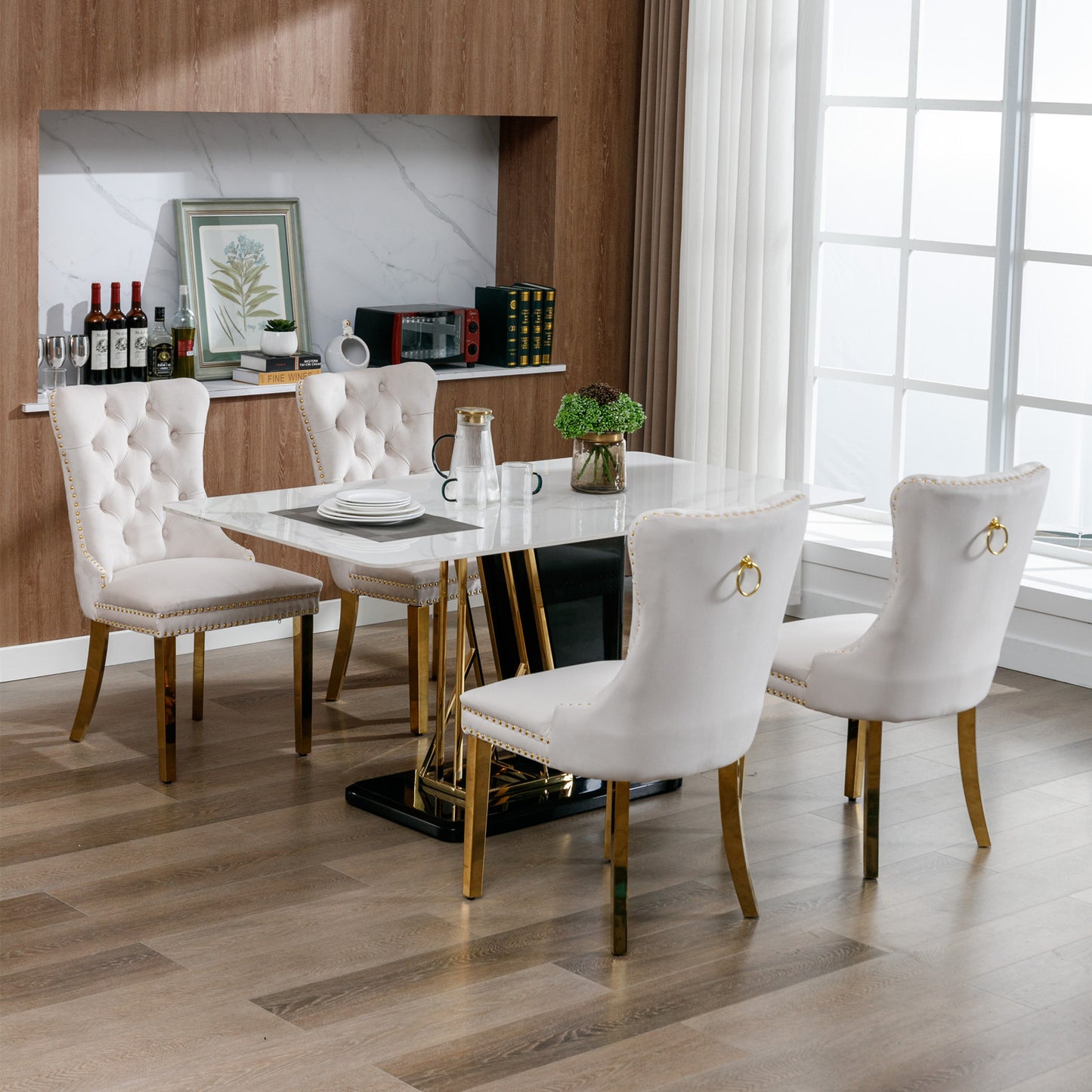 Tufted beige velvet dining chair with gold ring pull and gold legs
