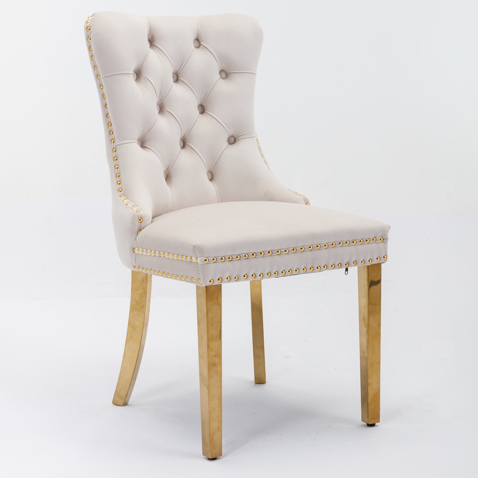 Cream velvet dining chair with gold nailhead trim and modern gold legs