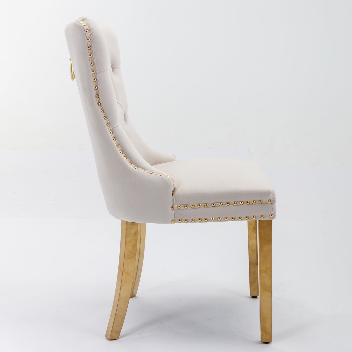 Cream velvet dining chair with gold trim and ring pull
