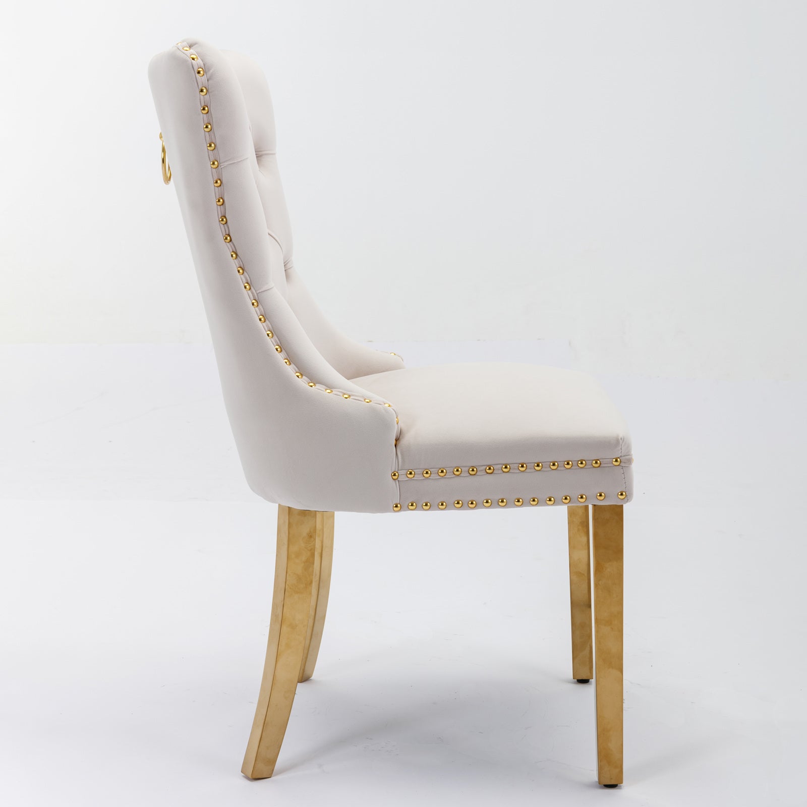 Cream velvet dining chair with gold trim and ring pull