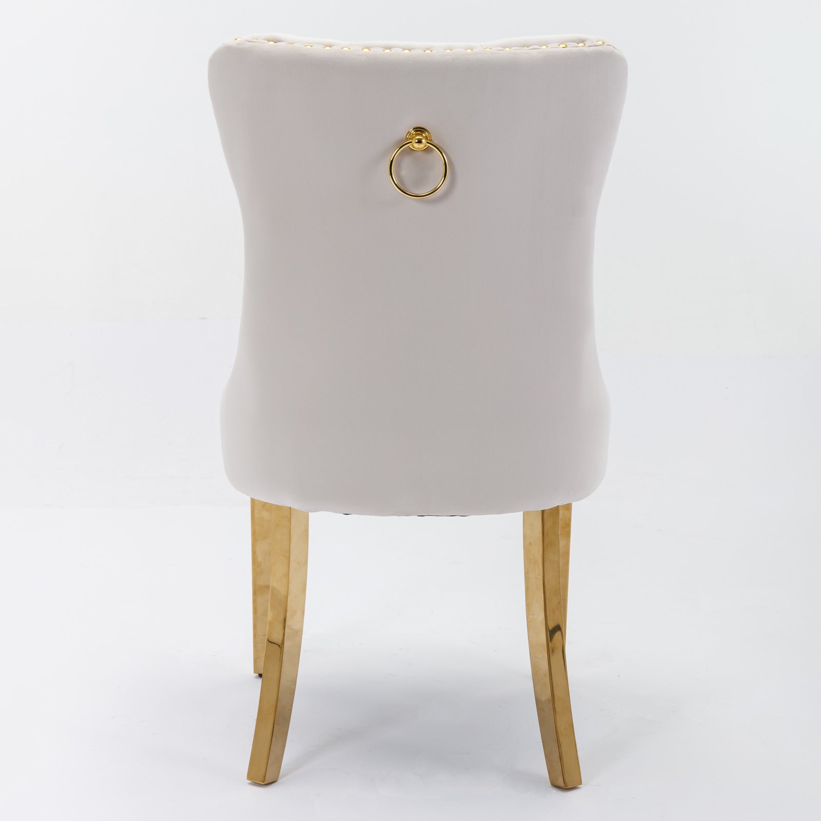 Light grey velvet dining chair with gold ring pull and gold legs
