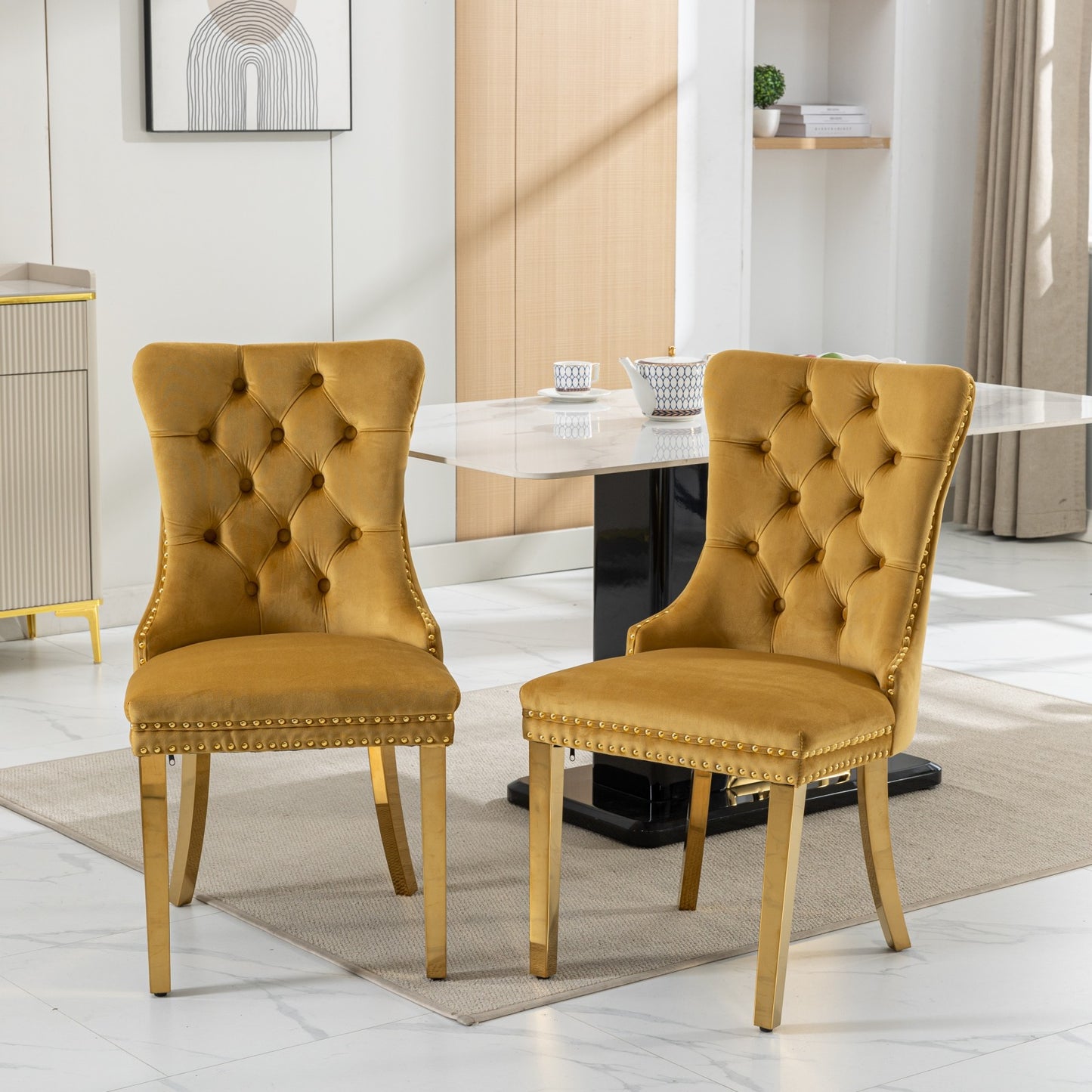 Golden velvet tufted dining chair with nailhead trim and gold legs