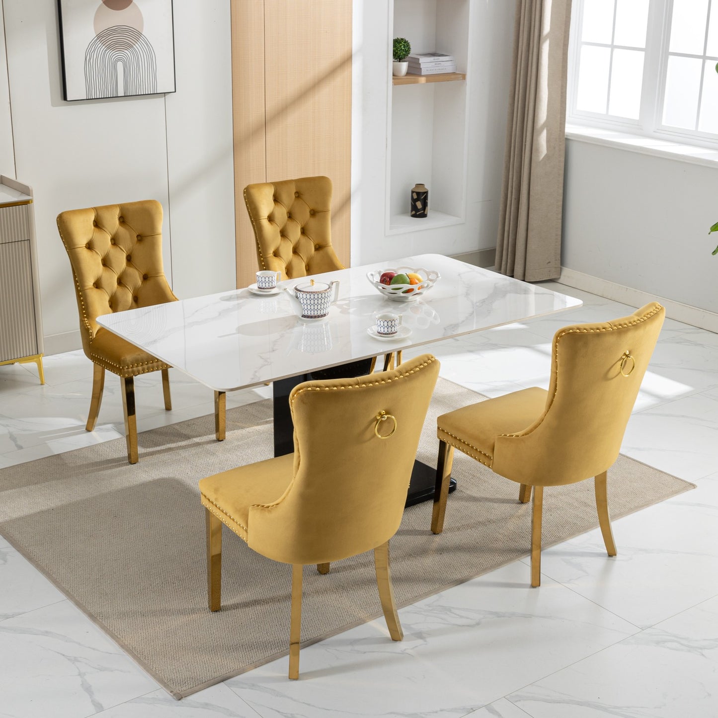 Tufted yellow velvet dining chair with gold ring accent and legs
