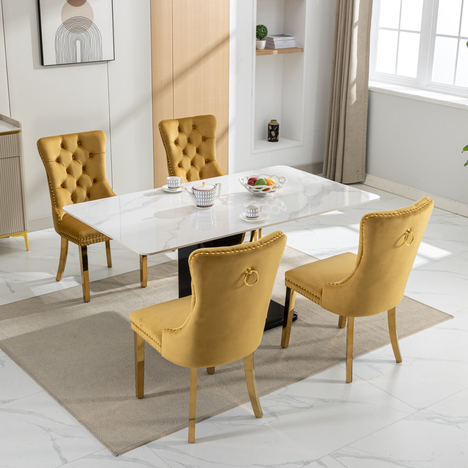 Tufted yellow velvet dining chair with gold ring accent and legs