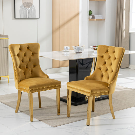 Mustard velvet dining chairs with gold accents and button tufting