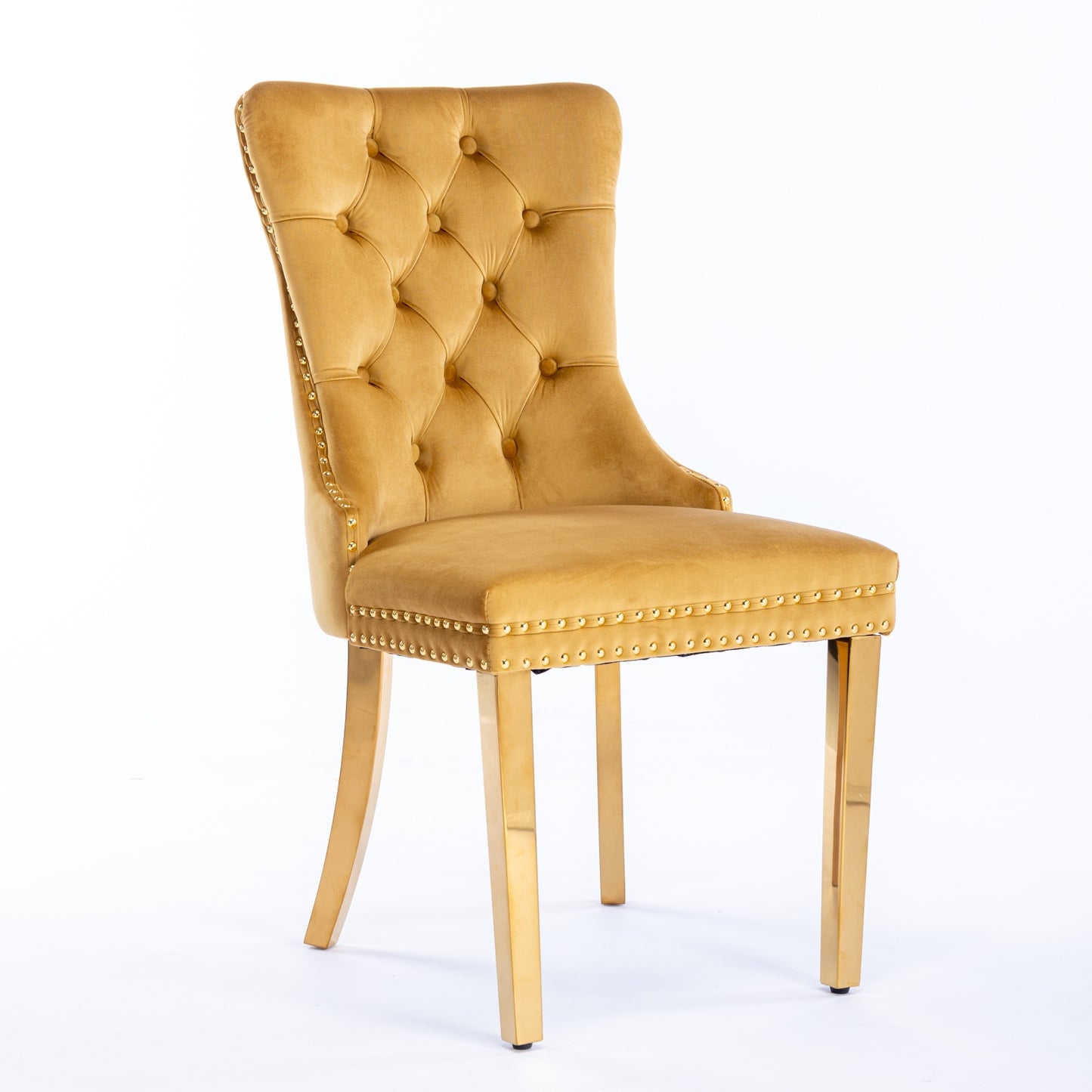 Gold velvet tufted dining chair with brass legs