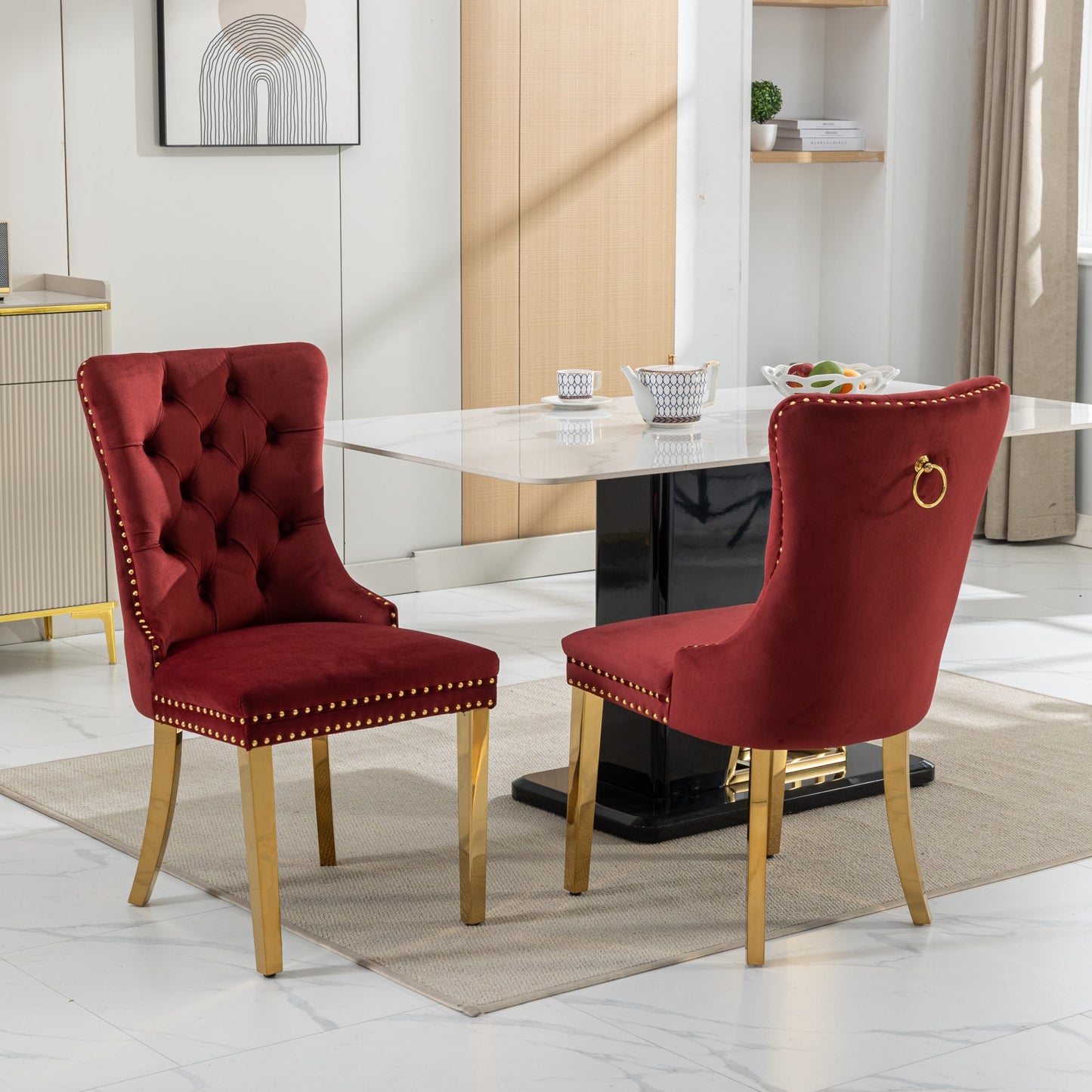 Red velvet tufted dining chair with gold nailhead trim and gold legs