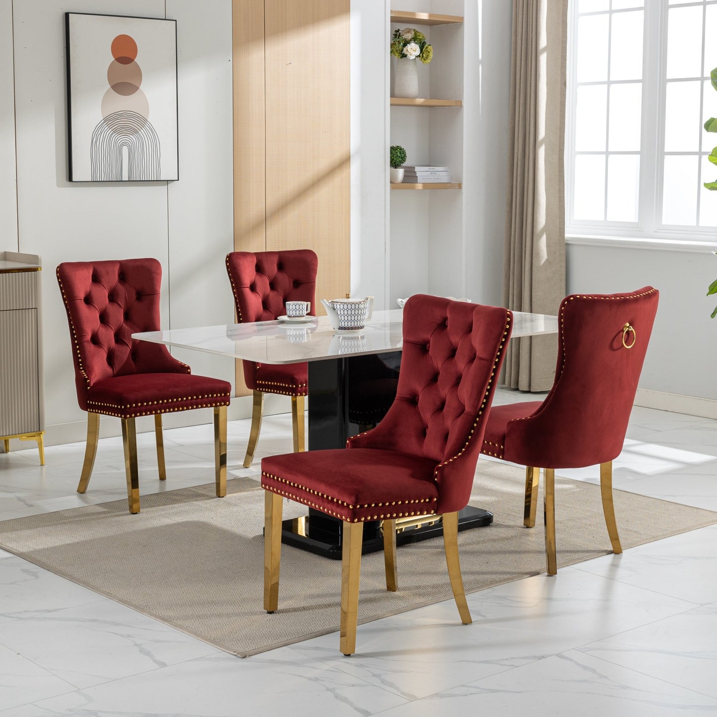 Set of  rich burgundy velvet dining chairs with gold nailhead trim and gold legs