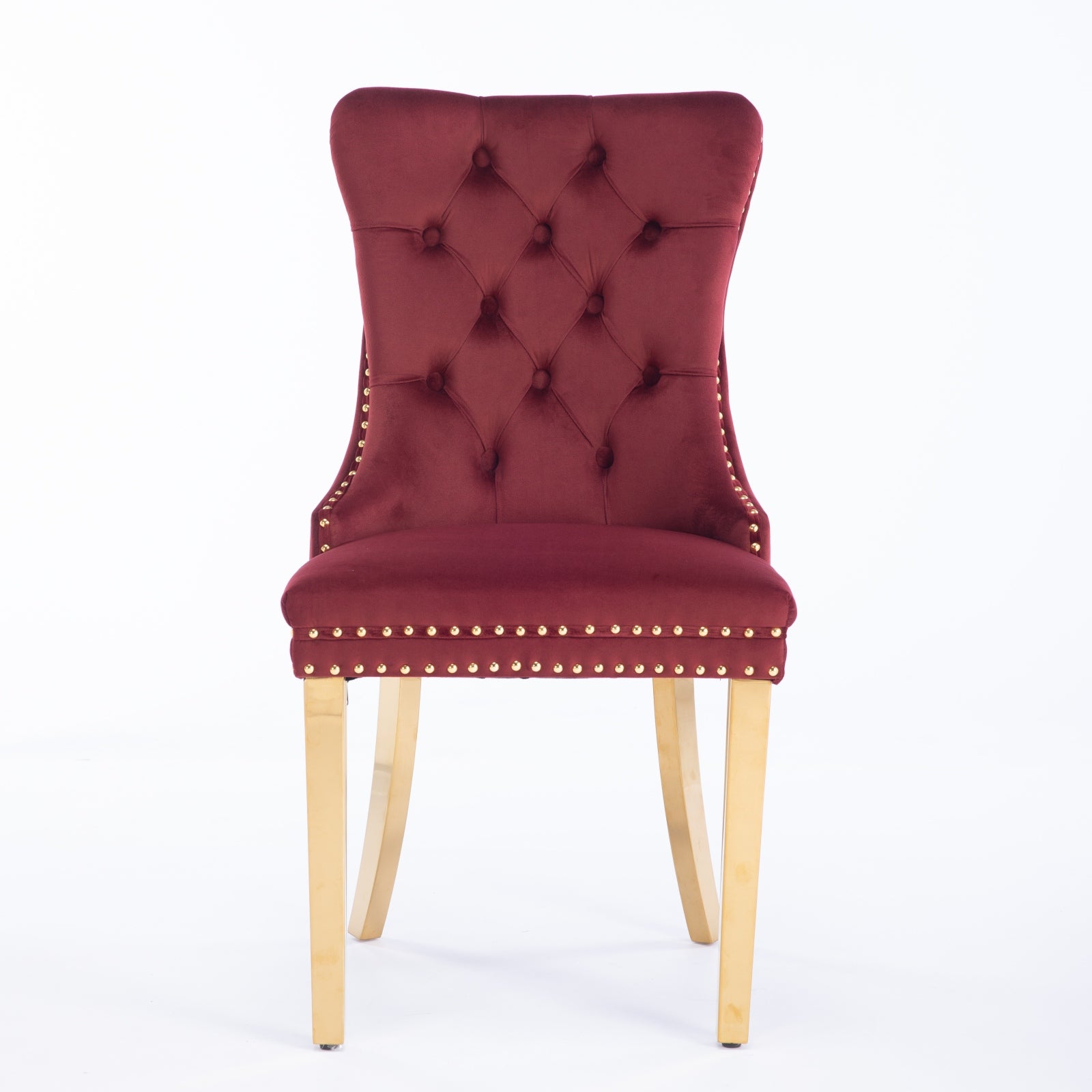 Burgundy velvet dining chair with tufted back and gold nailhead trim