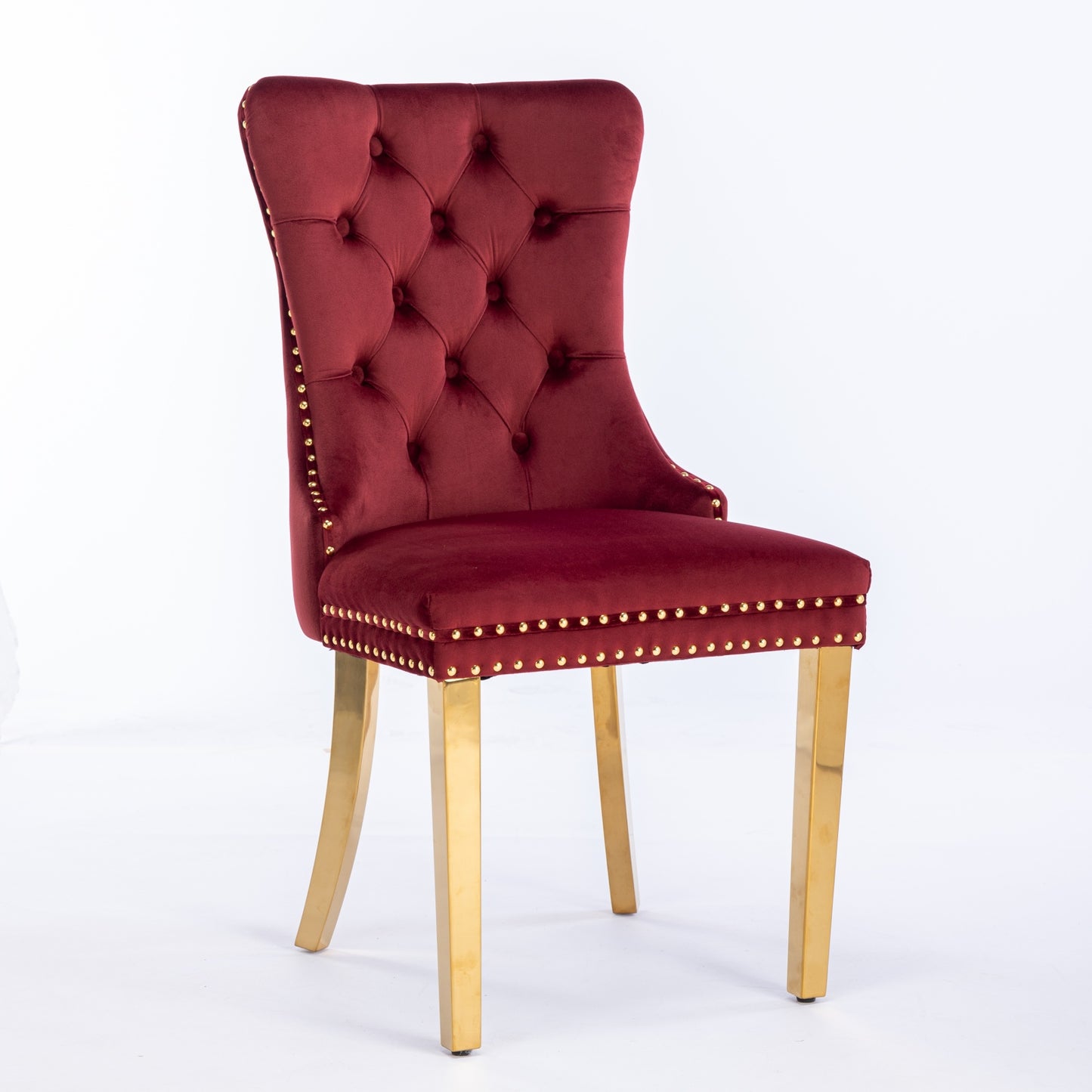 Velvet dining chair in deep red with tufted back and gold accents