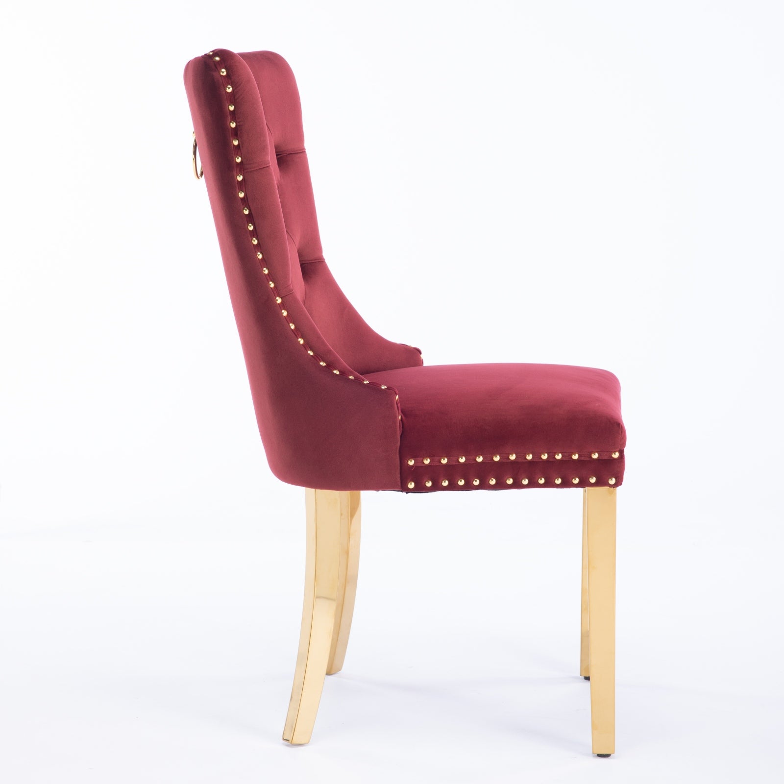 Red velvet dining chair with gold stud accents and gold legs