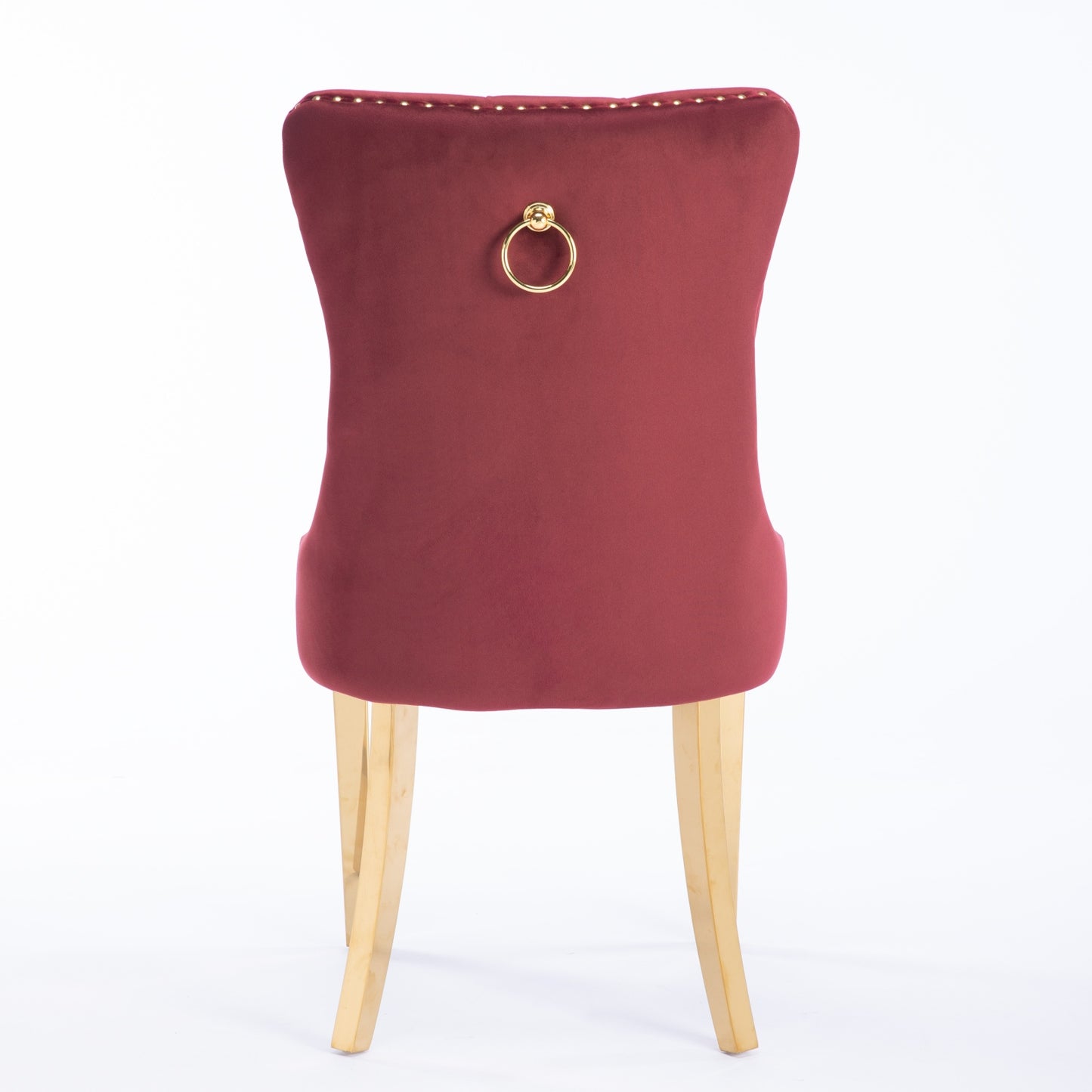 Red velvet dining chair with gold ring pull and brass legs