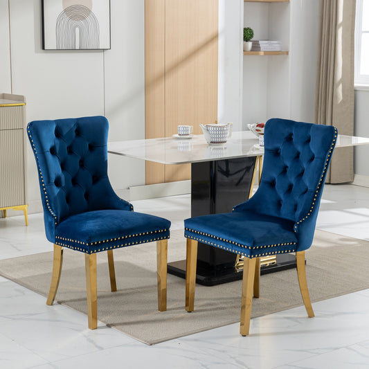 Deep blue velvet dining chair with gold nailhead trim and brass legs