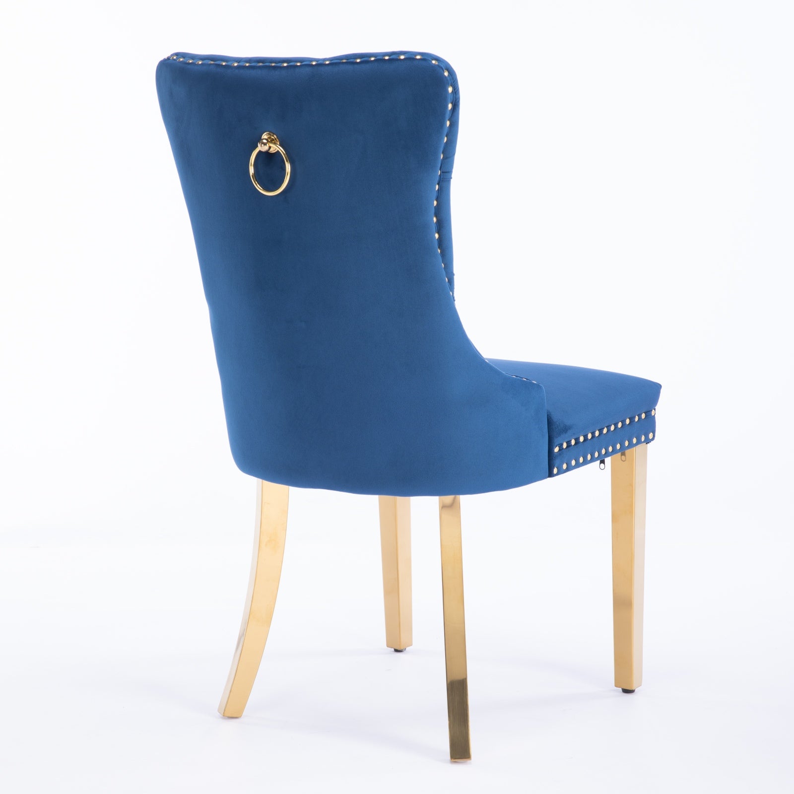 Blue velvet accent chair with tufted back and gold lion ring pull