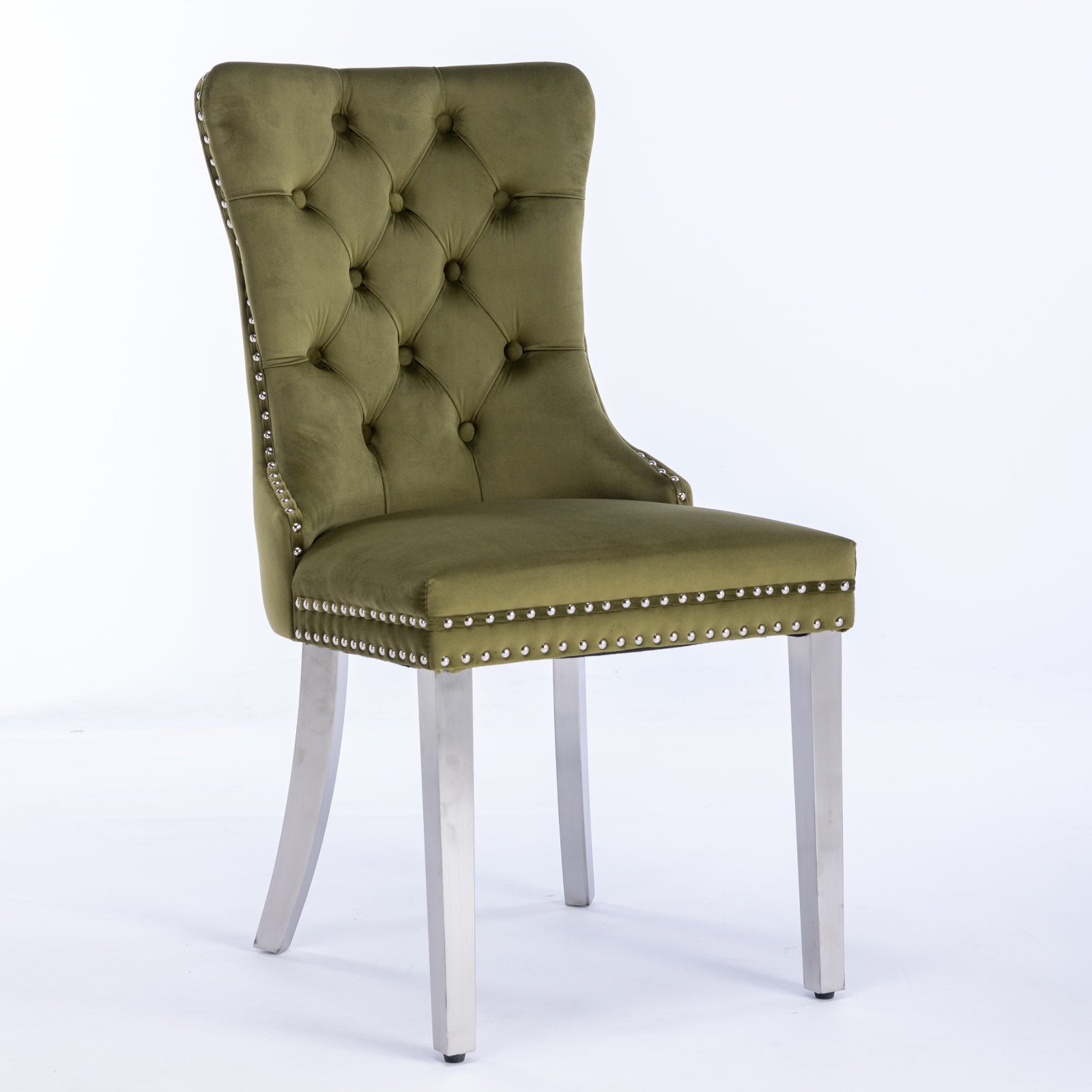 Green velvet dining chair with button tufting and silver nailhead trim