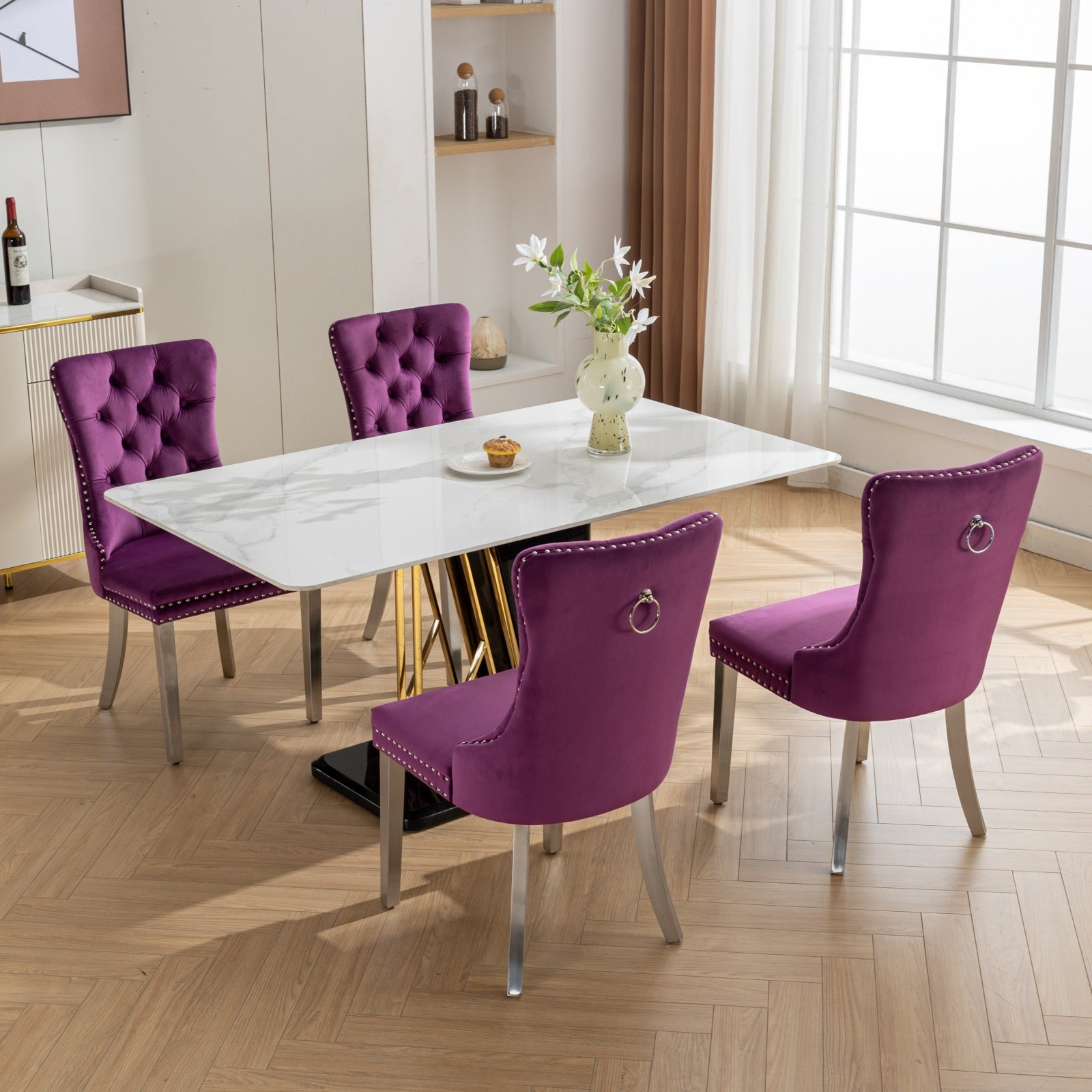 Tufted purple velvet dining chair with silver nailhead trim and ring accent