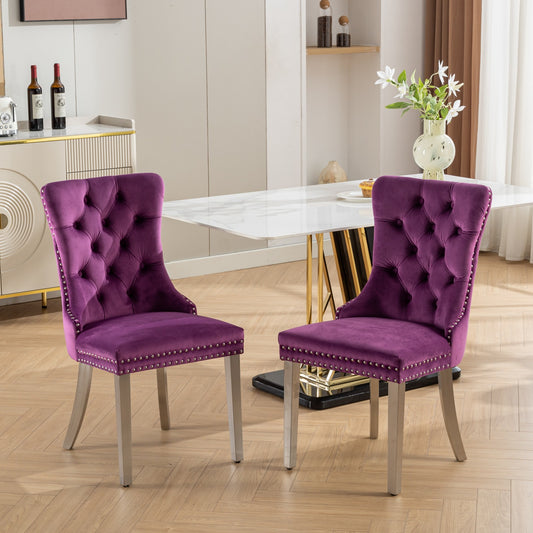 Tufted purple velvet dining chair with silver nailhead trim and brushed metal legs