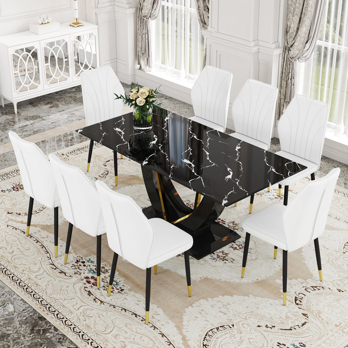 Black marble dining table with pedestal base and  white upholstered chairs