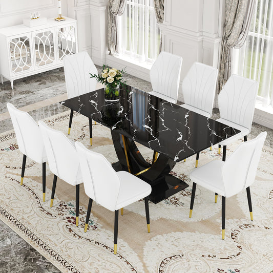 Black marble dining table with pedestal base and  white upholstered chairs