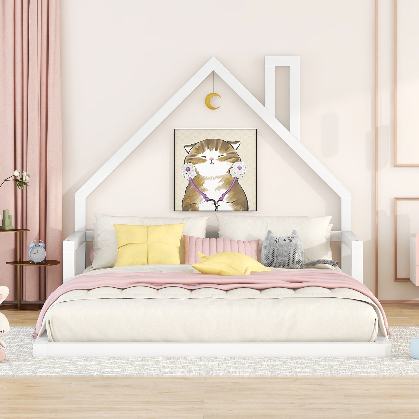 White house frame bed with plush pillows and a catthemed painting