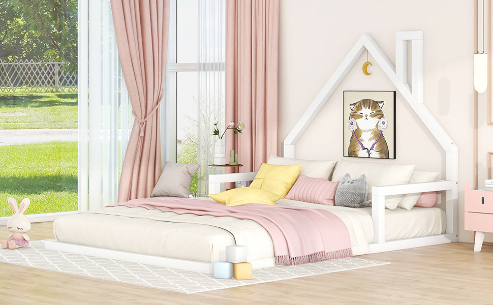White wooden house bed frame for kids featuring a playful cat artwork and soft pink bedding