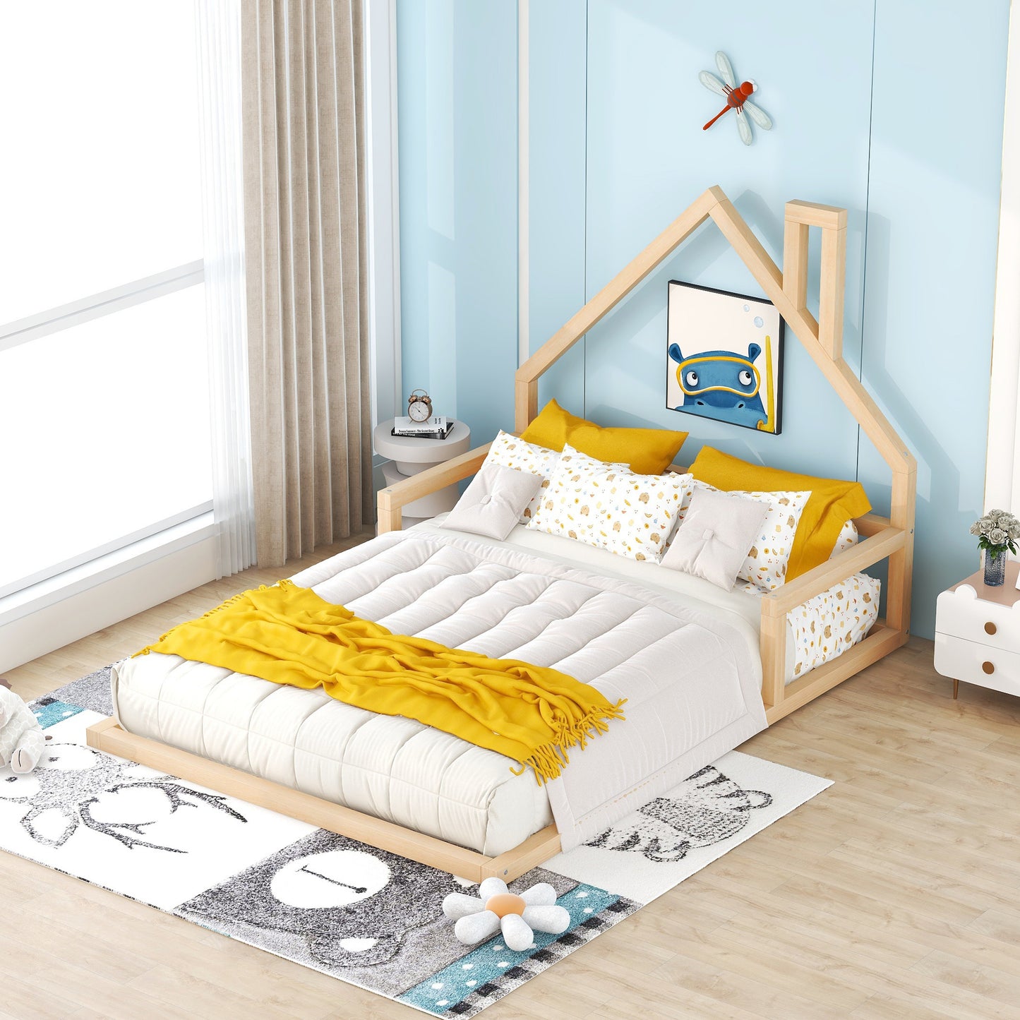 Wooden house frame toddler bed with white bedding and yellow throw