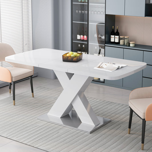 Glossy white extendable dining table with a modern Xbase and chrome accents