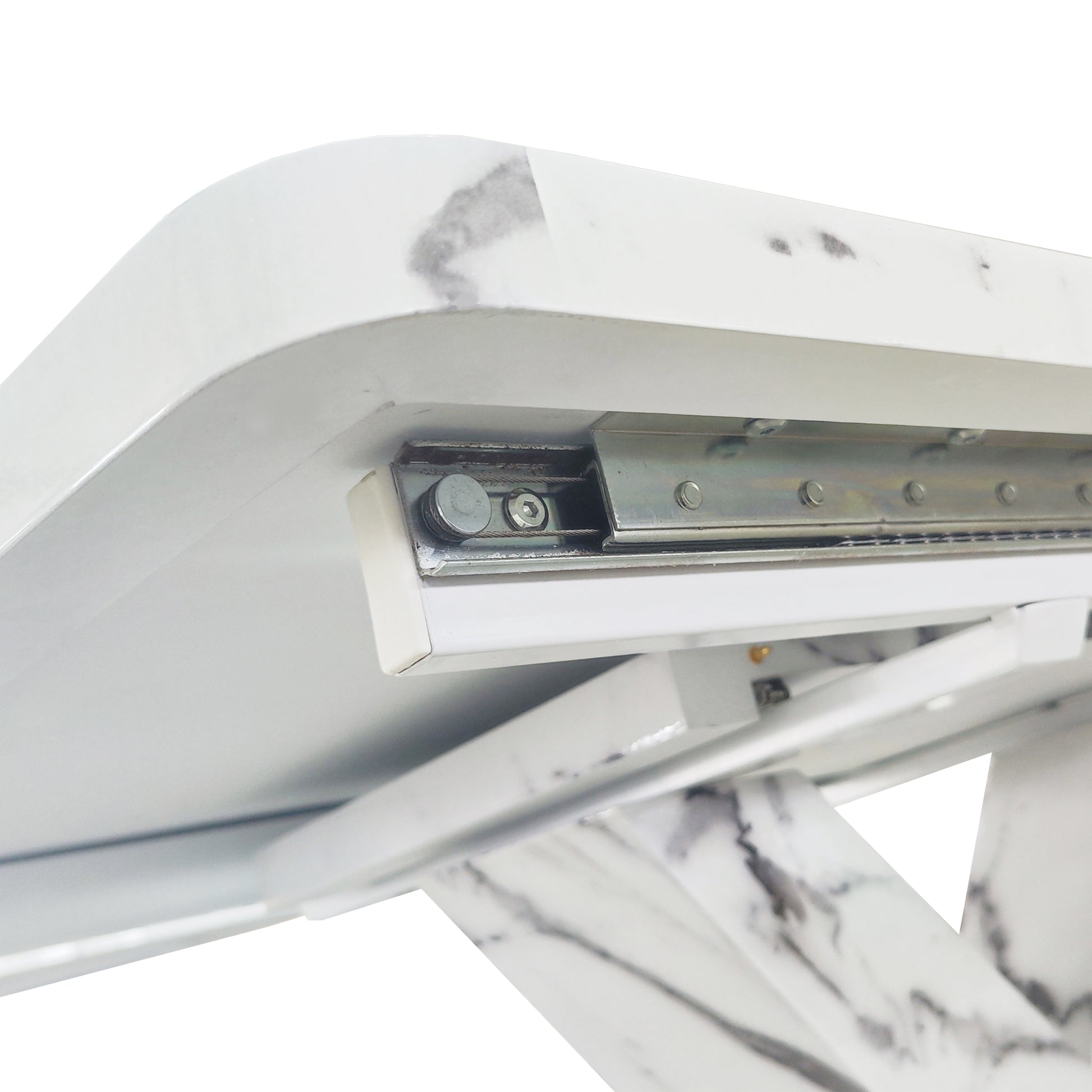 Closeup of a white marble extendable dining table slide mechanism