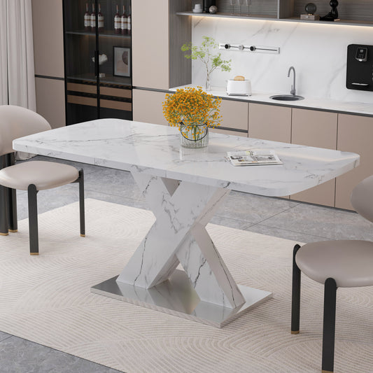 White marble dining table with modern Xshaped pedestal base and chrome accents