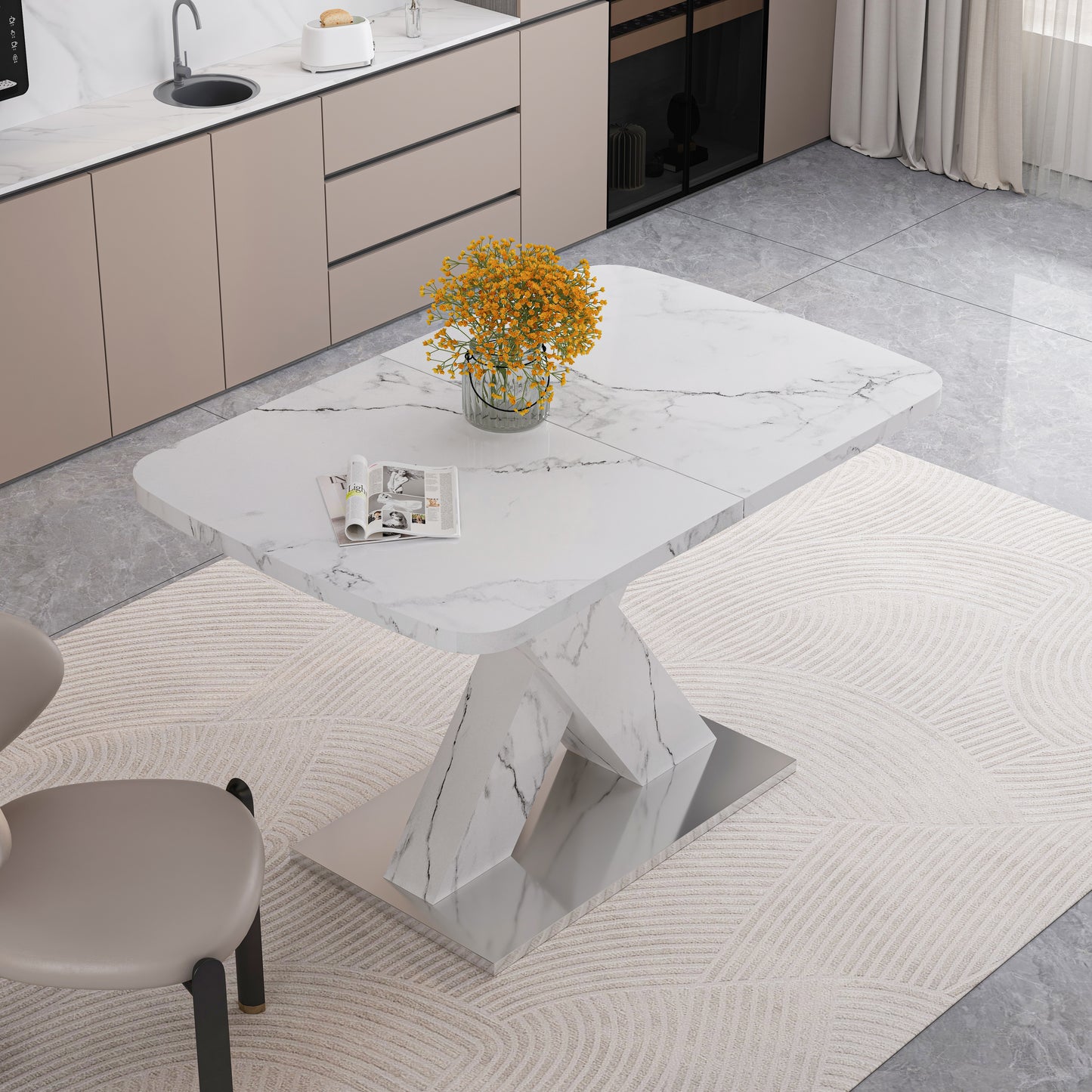Modern marble dining table with chrome base on a textured rug