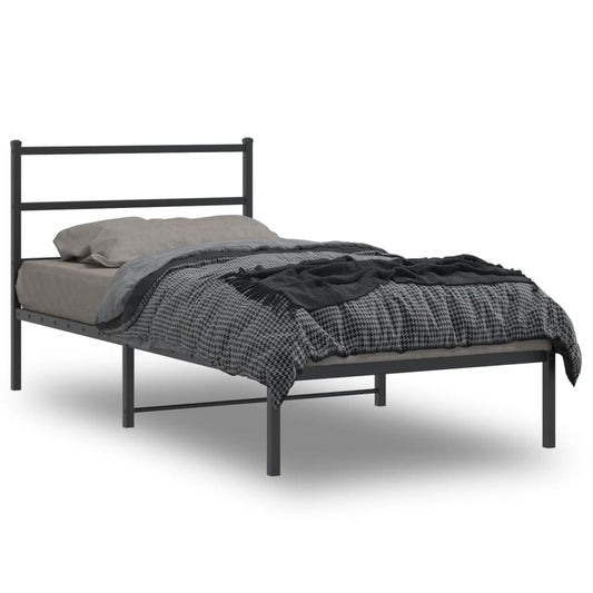 Dark gray metal bed frame with simple horizontal headboard and footboard dressed with gray bedding