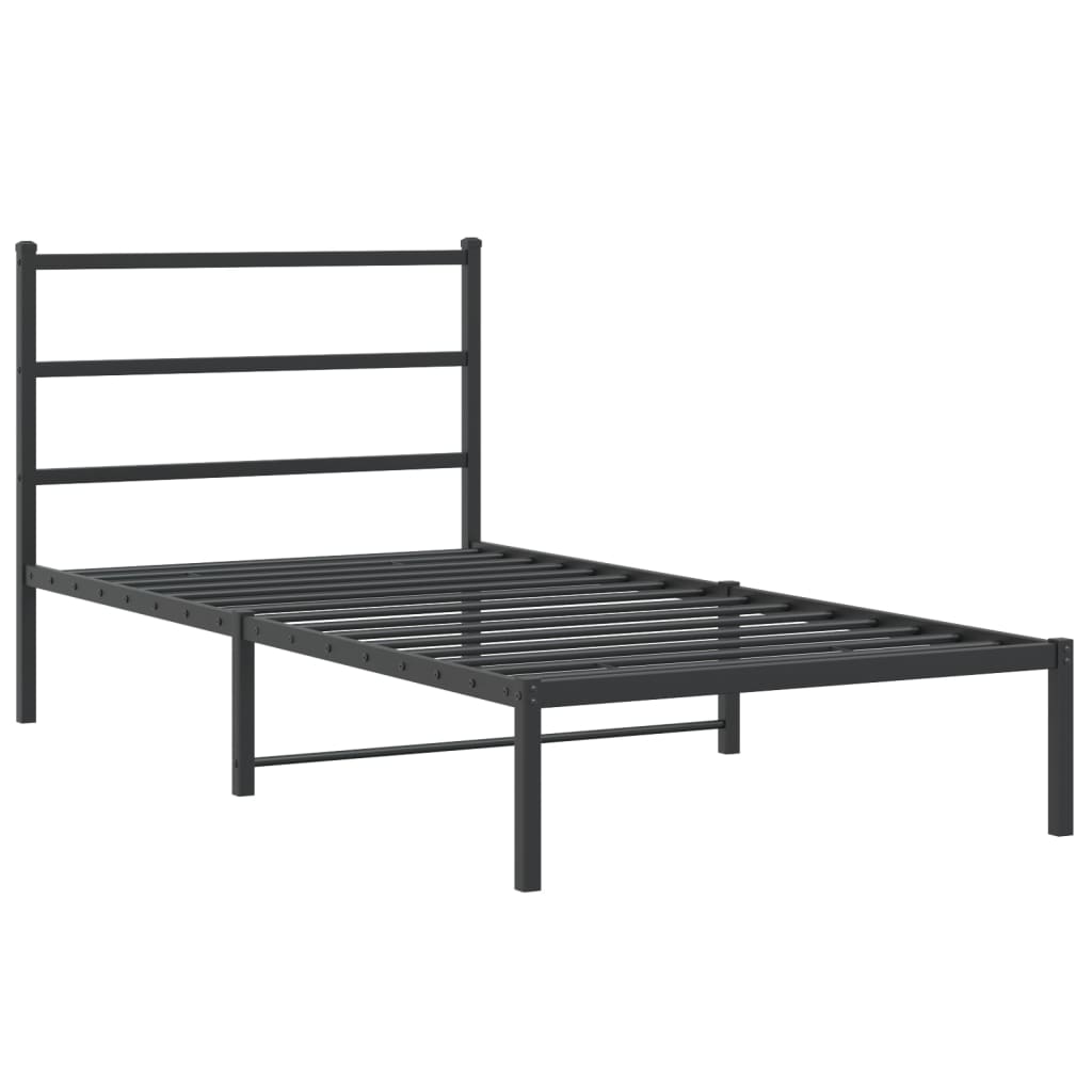 Dark grey metal twin bed frame with a white mattress