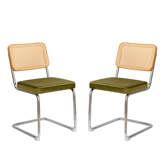 Two chrome cantilever chairs with olive green velvet seats and cane backs
