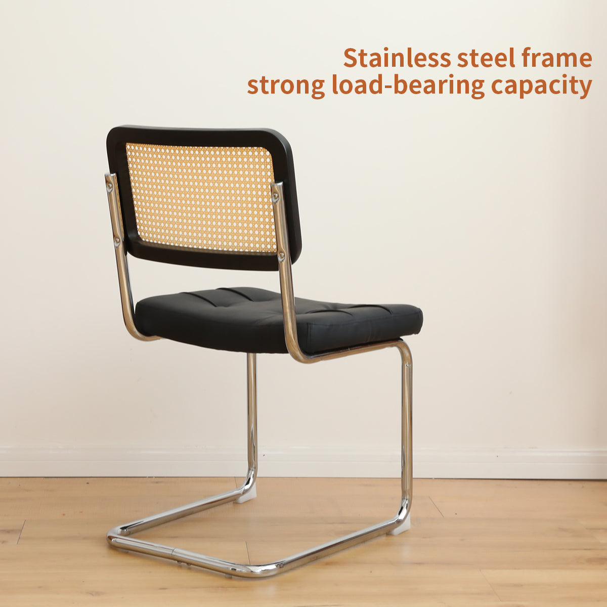 Black leather and cane accent chair with chrome cantilever base