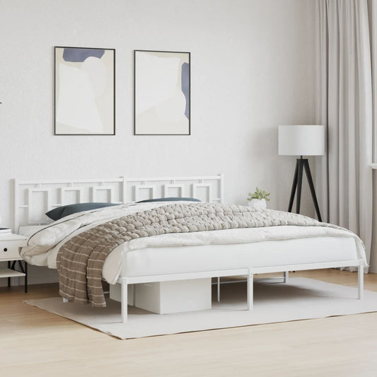 White metal bed frame with a geometric headboard and upholstered blanket