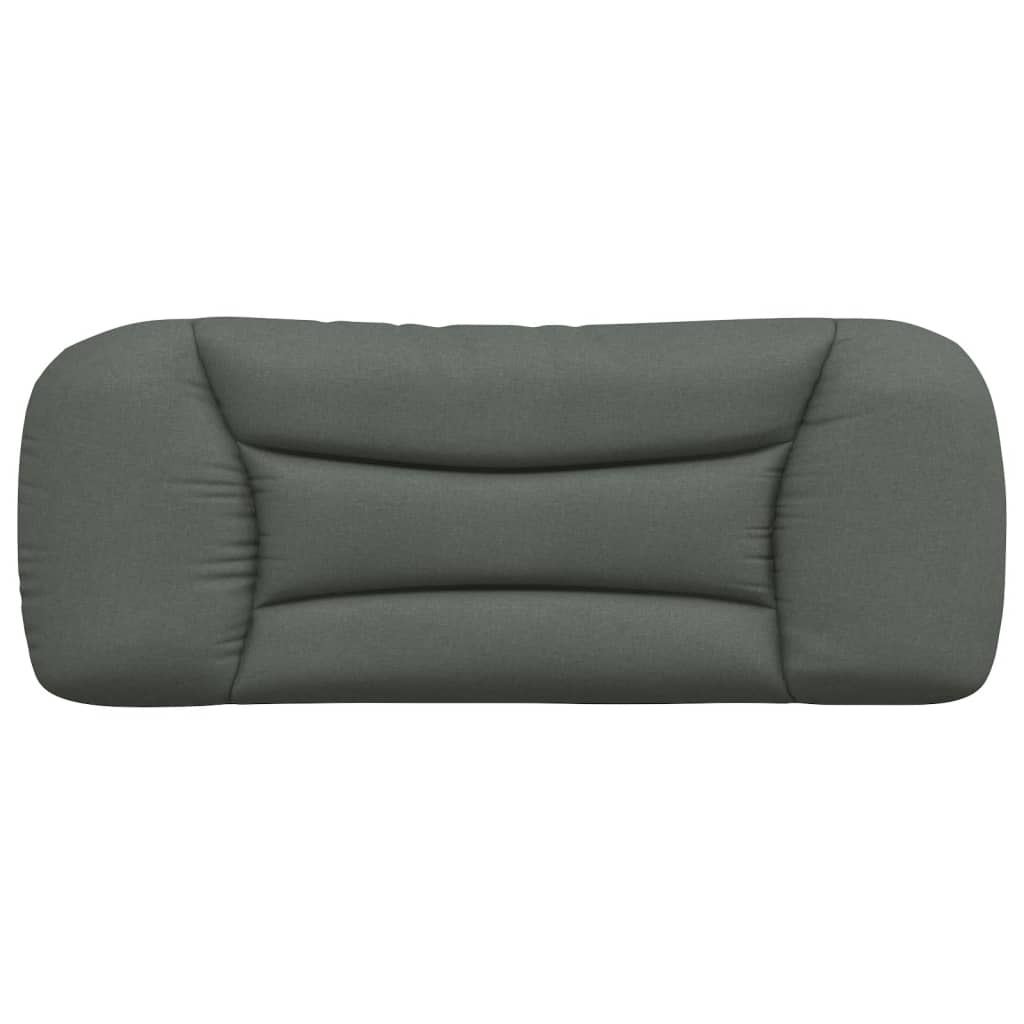 Dark gray tufted upholstered headboard mounted on a white wall above a bed